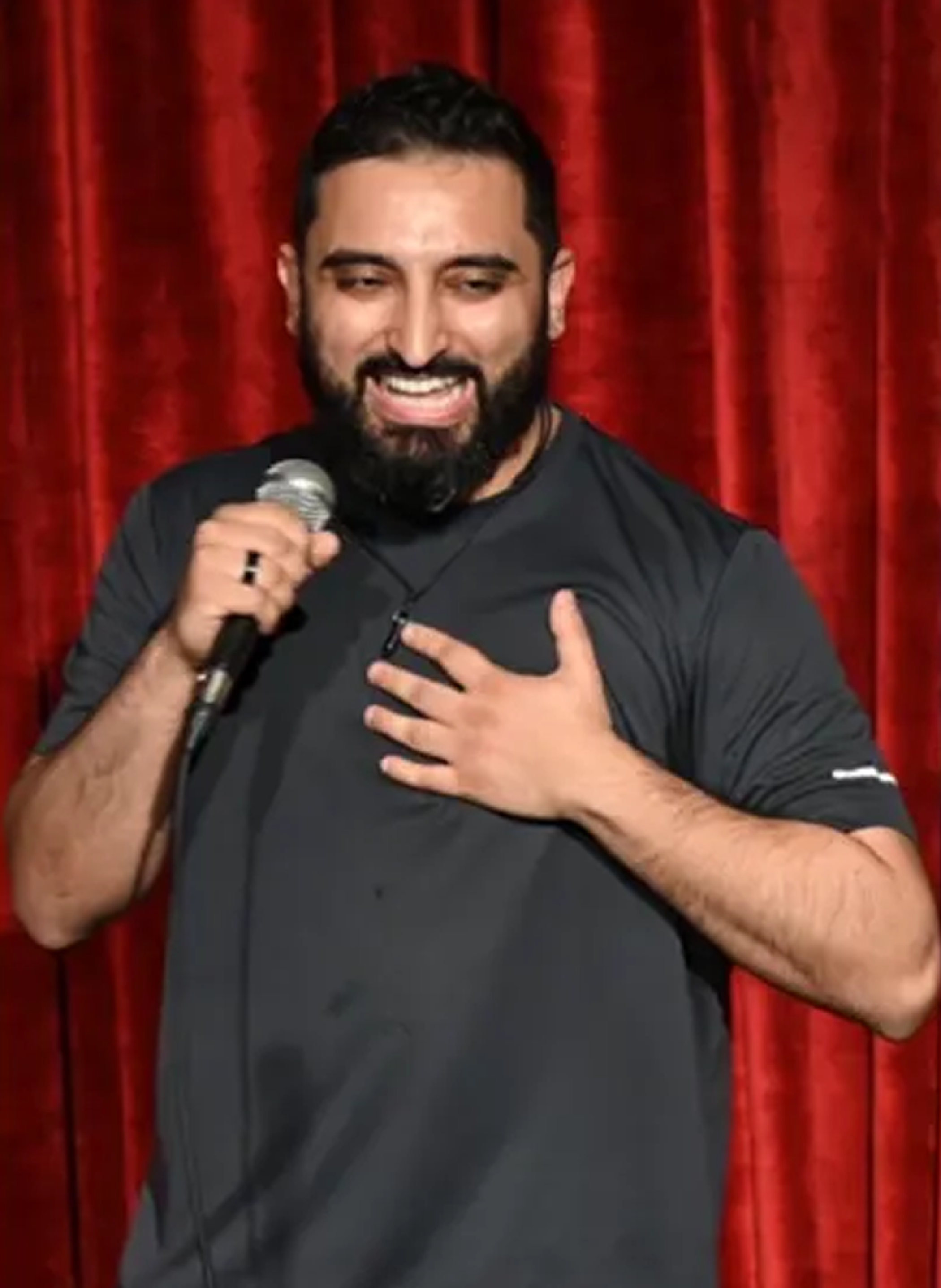 Dr. Shehz performing stand-up comedy